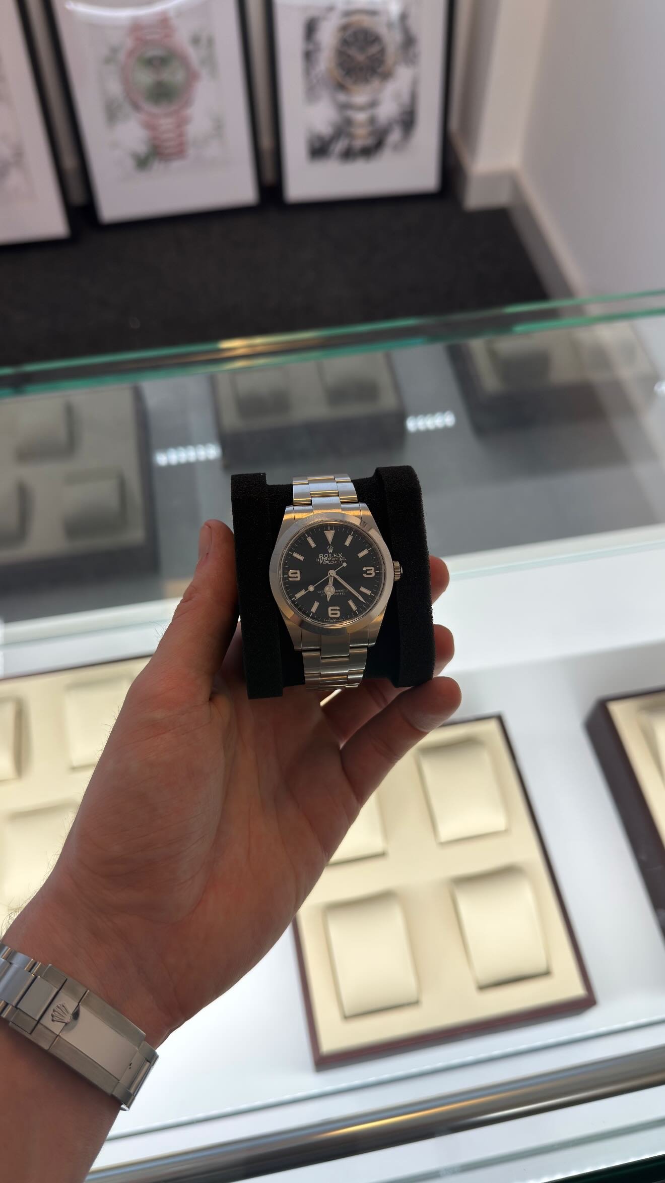 A Rolex Explorer with a black dial