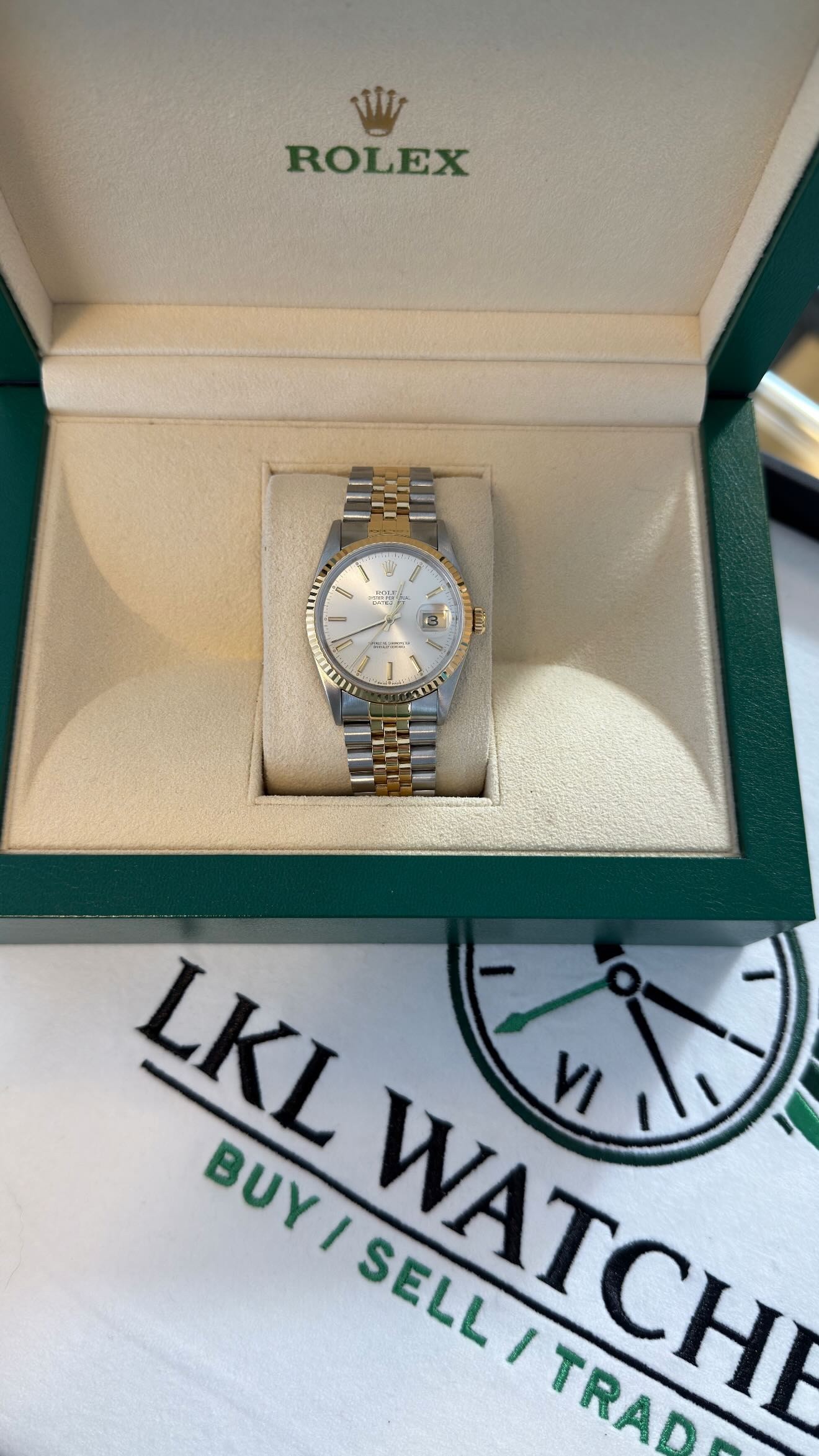 A Rolex Datejust presented in its box with papers, guarantee card and an LKL Watches business card
